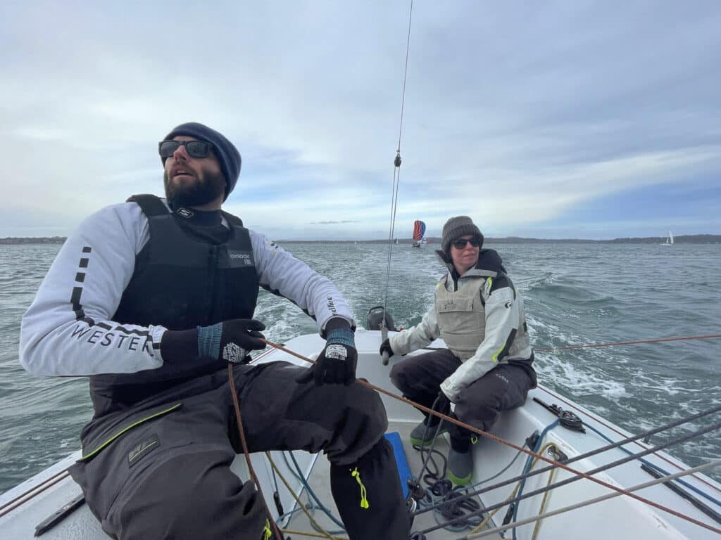 Onboard shot facing aft. Amoore is pursuit racing. Bmoore, another Moore 24, can be seen among the fleet behind.