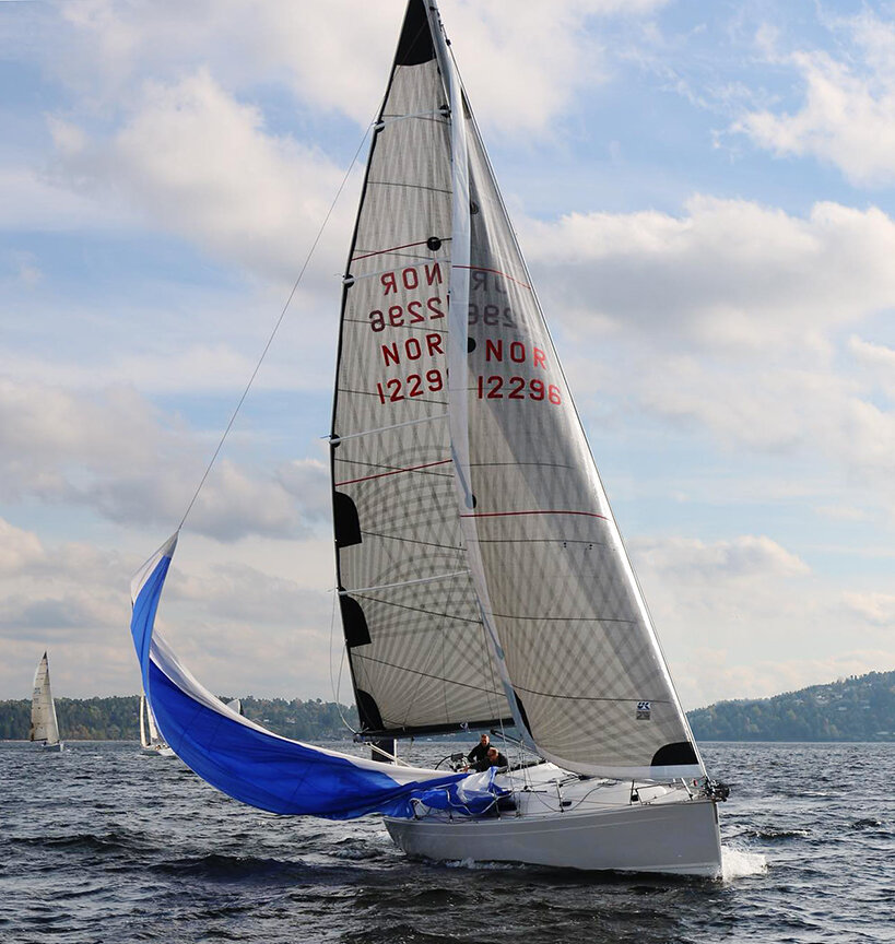 Sail handling skills and planning ahead are paramount in shorthanded racing. When approaching a leeward mark, it pays to get the kite down earlier than you would with a full crew.