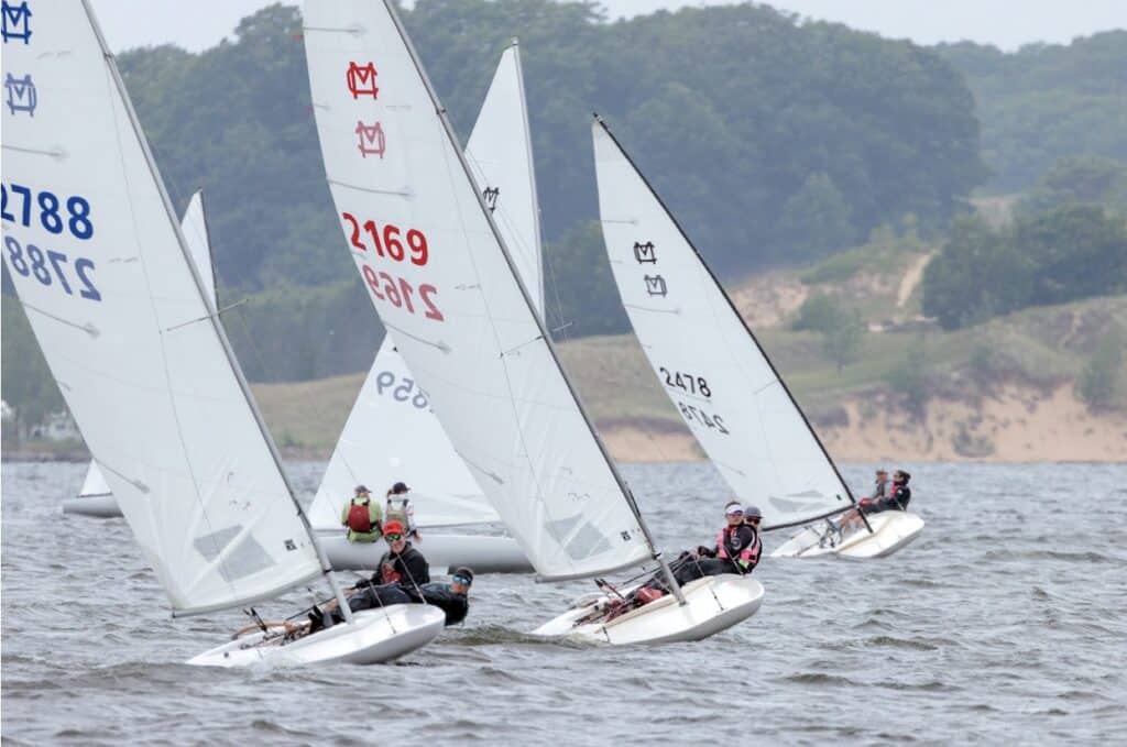 UK's MC Scow sails leading the fleet at the 2023 Western Michigan Championships. Photo credit: Bill Crawford.