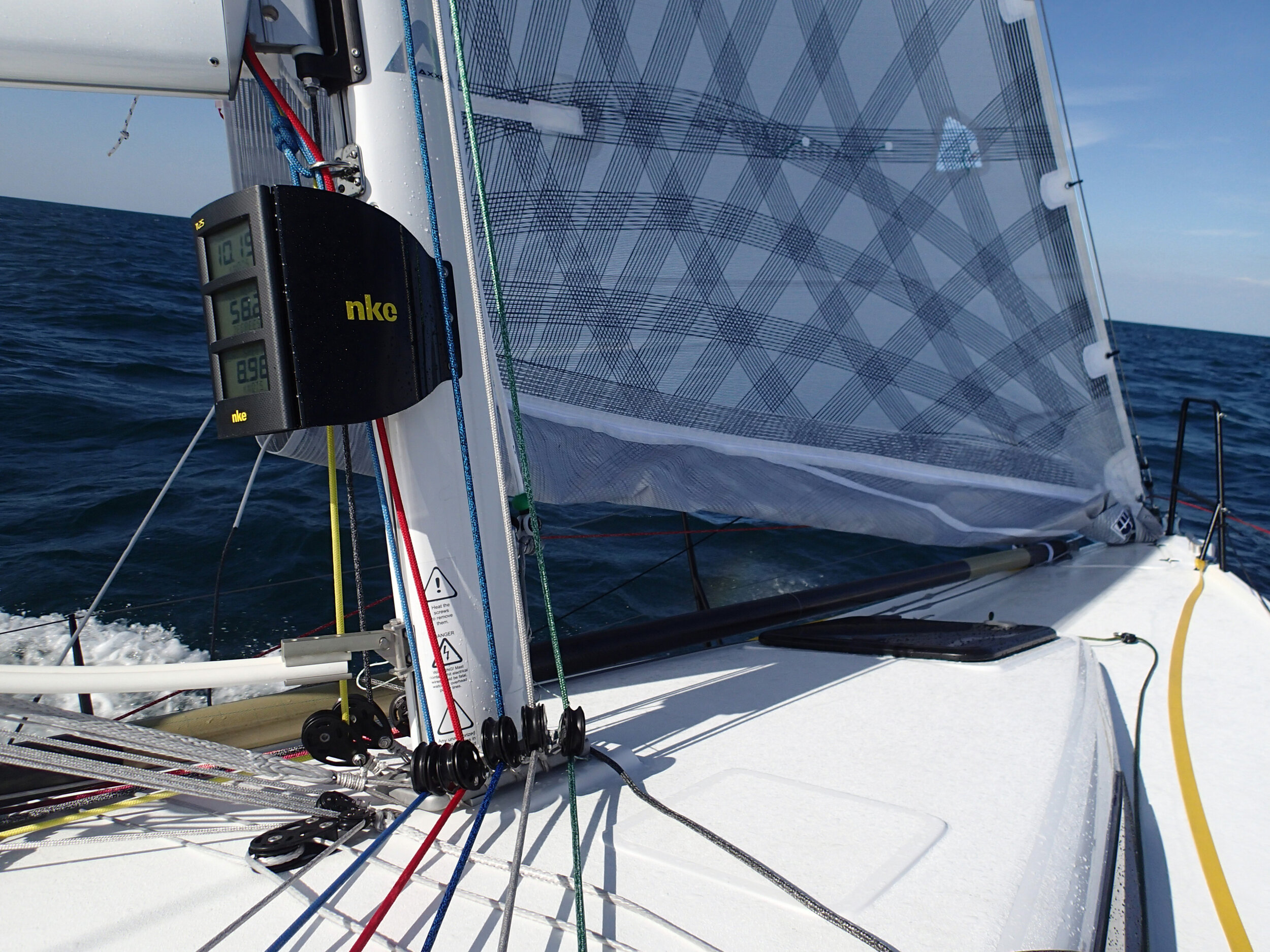 Above is an X-Drive jib with a reef in it. The reduced foot area has been rolled up and then zipped in place. The vertical reef is a fast way for shorthanded sailors to reduce sail area.