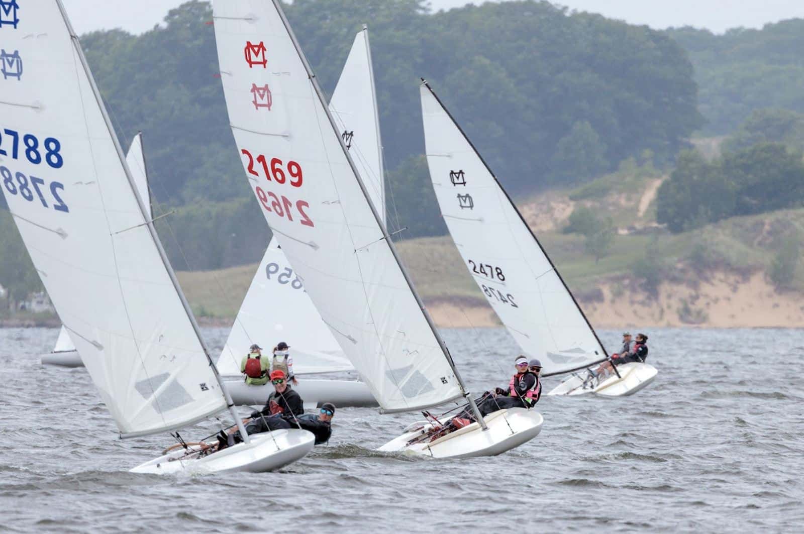 UK's MC Scow sails leading the fleet. Photo by Bill Crawford.